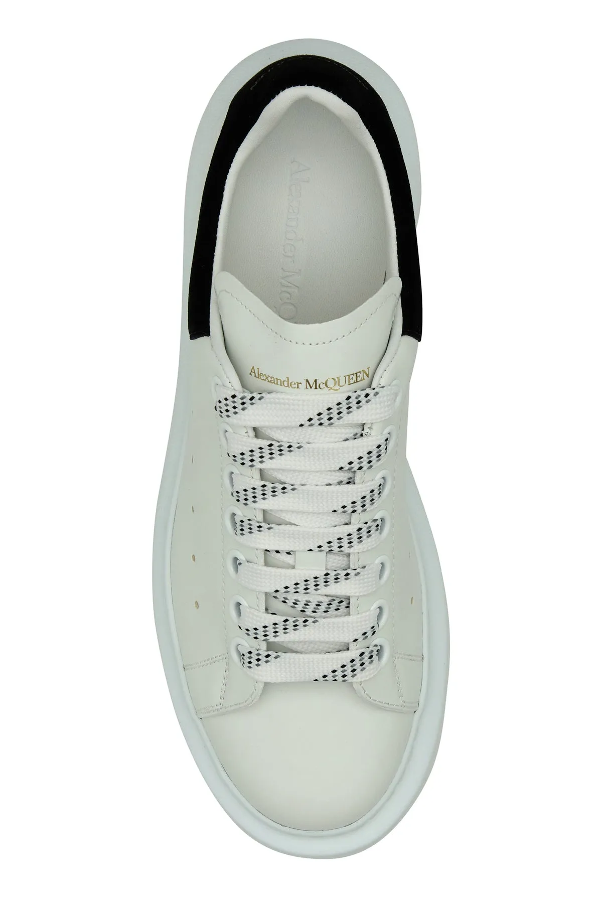 White leather sneakers with black suede heel