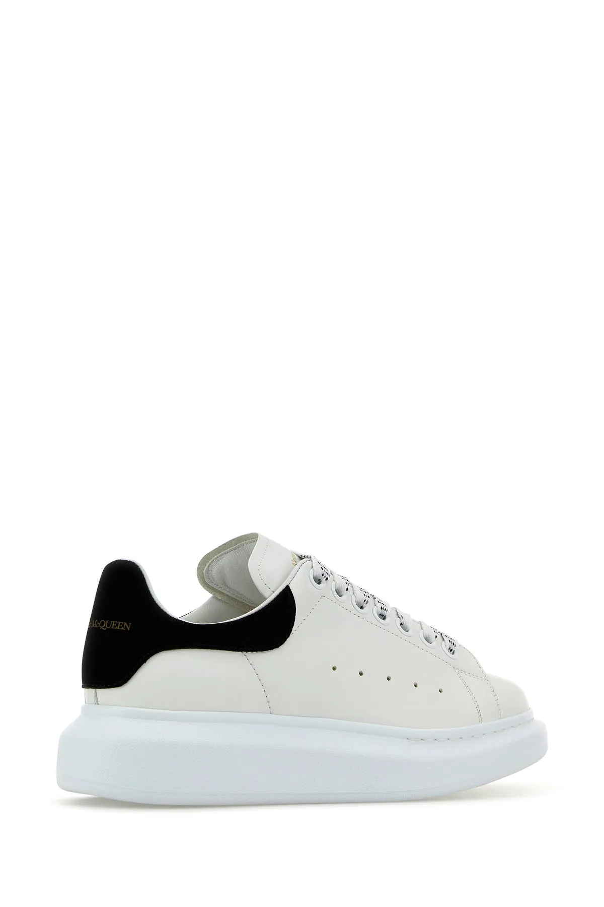 White leather sneakers with black suede heel